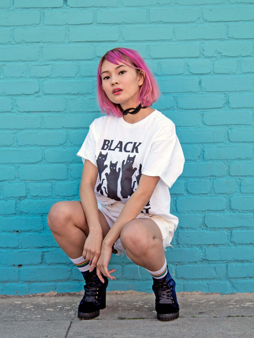 White graphic tee with a Black Flag parody by Little Tokyo brand Popkiller.