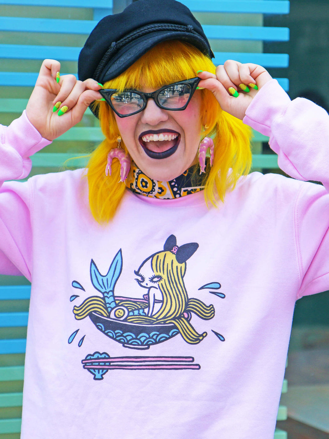Model wearing a seafood ramen themed sweater.