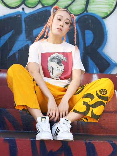 Model wearing a surf punk graphic t-shirt.