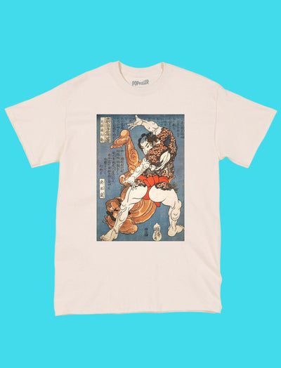 A beige t-shirt with a sumo wrestler performing judo on it.