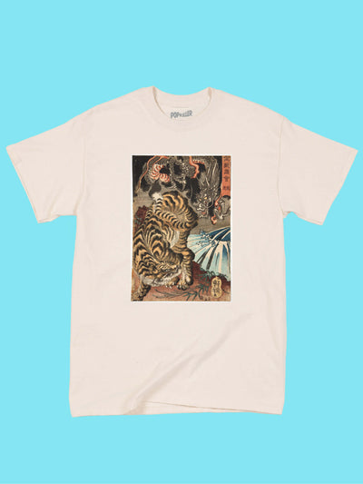A beige t-shirt with traditional Japanese art of a tiger and dragon fighting on it.