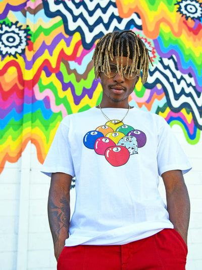 White graphic tee with kawaii rainbow art by Los Angeles artist Naoshi.