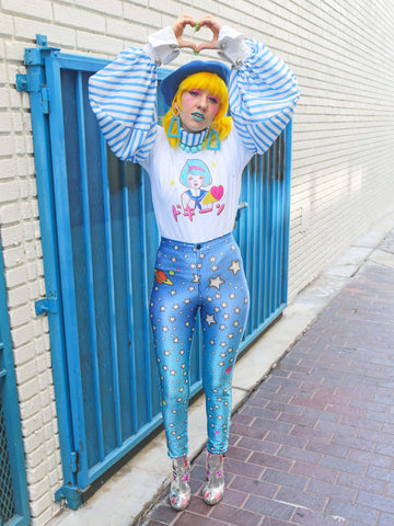 Model wearing a graphic t-shirt with a Japanese school girl on it.