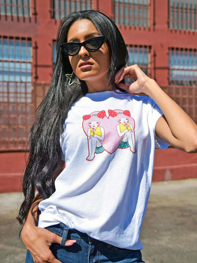 Model wearing a kawaii pink heart character t-shirt.