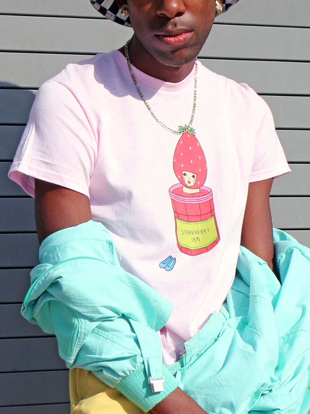 Pink graphic tee with kawaii strawberry by Los Angeles artist Naoshi.
