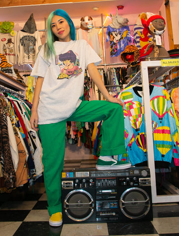 Model wearing vintage manga inspired retro girl graphic t-shirt.