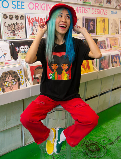 Model wearing afro twin heart graphic t-shirt.
