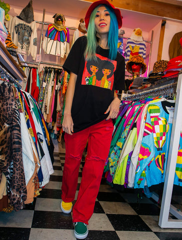 Model wearing black women heart afro design t-shirt.
