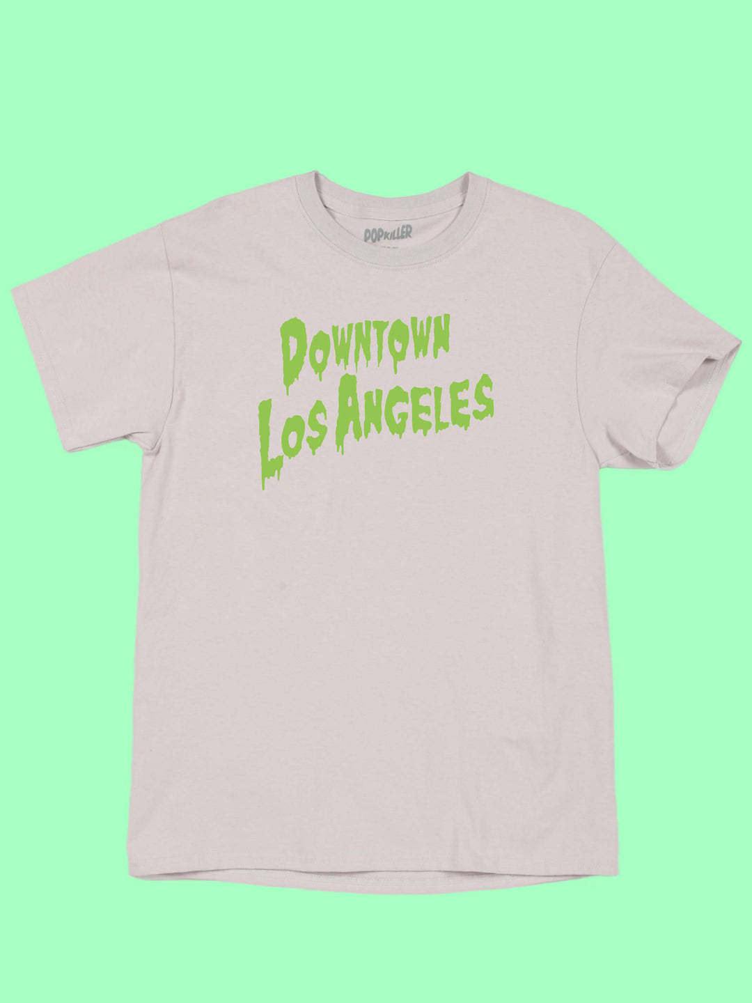 A grey t-shirt with the words 'Downtown Los Angeles' in a green horror font.