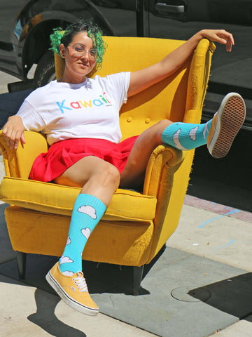 A model wearing a vaporwave kawaii graphic tee.