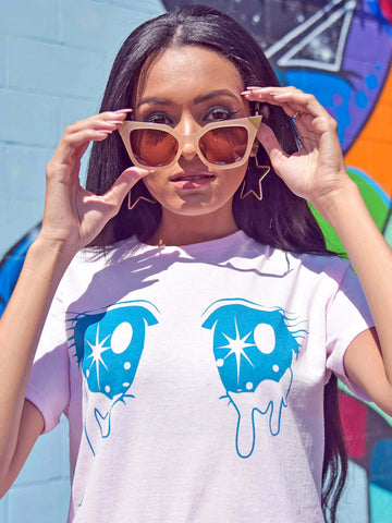 A model wearing a mahou shoujo anime eyes t-shirt.