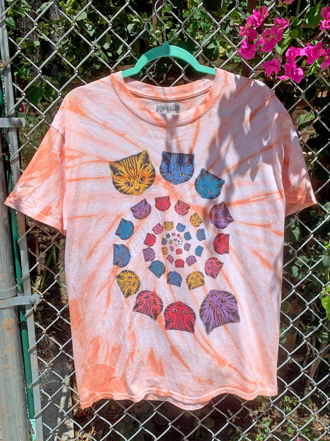 Rainbow spiral cat tie dye t-shirt.