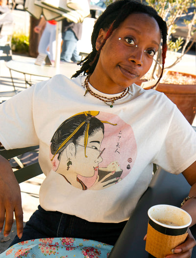 Model wearing Japanese Showa era geisha tee design drinking a latte.