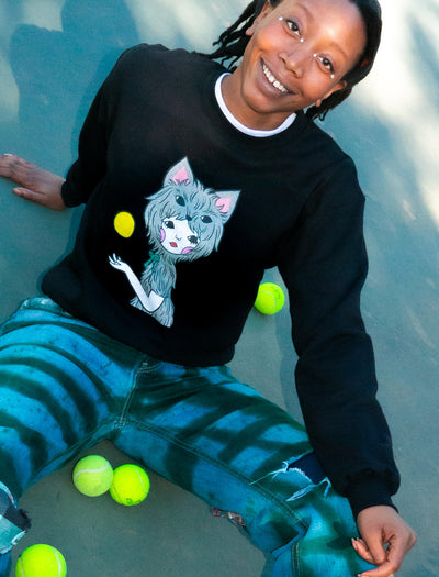 Model wearing sweatshirt with a design of a kawaii girl in werewolf skin holding the full moon.