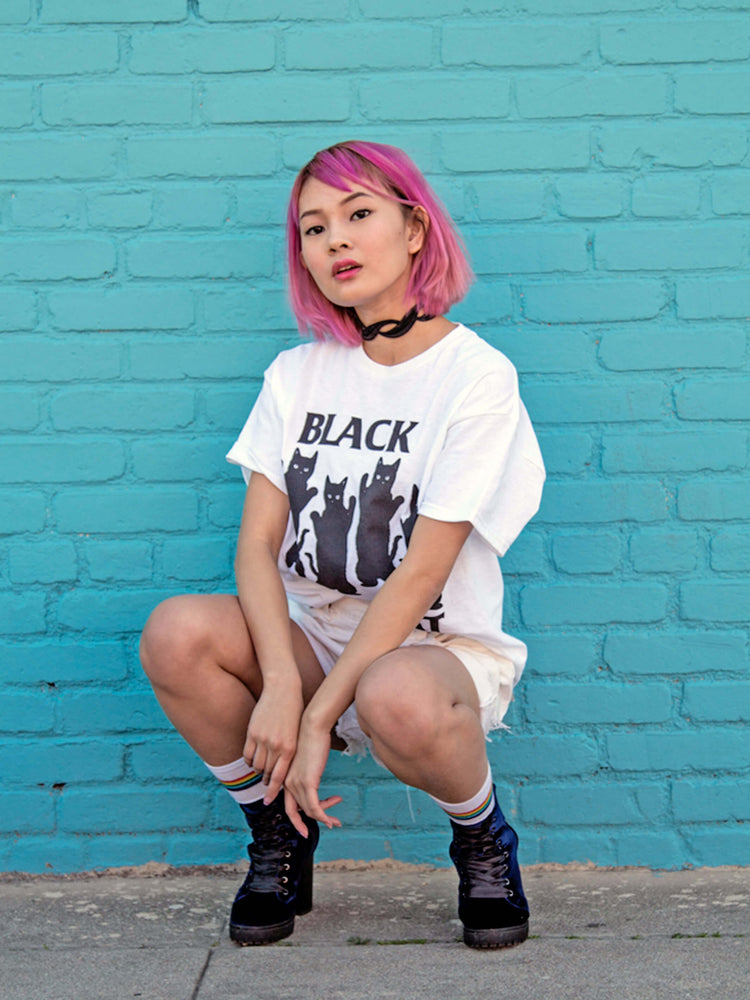 White graphic tee with a Black Flag parody by Little Tokyo brand Popkiller.