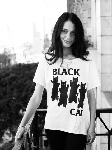 White graphic tee with a Black Flag parody by Los Angeles brand Popkiller.