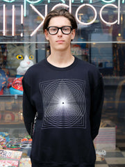 A model wearing a cool hipster sweater.