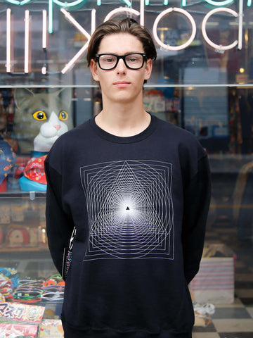 A model wearing a cool hipster sweater.