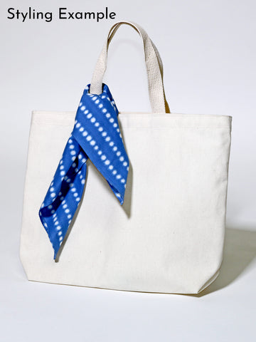 A styling example for a Japanese bandana tied around a purse.