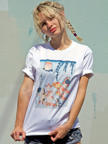 White t-shirt with Japanese goldfish dancing on it.