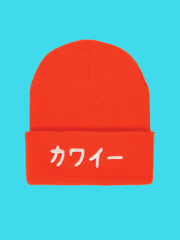 Bright orange Japanese beanie with the word 'Cute' or Kawaii embroidered in Japanese on it.
