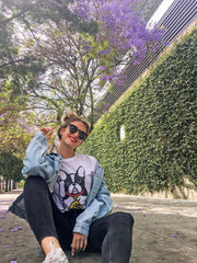 A model wearing a lucky dog graphic t-shirt.