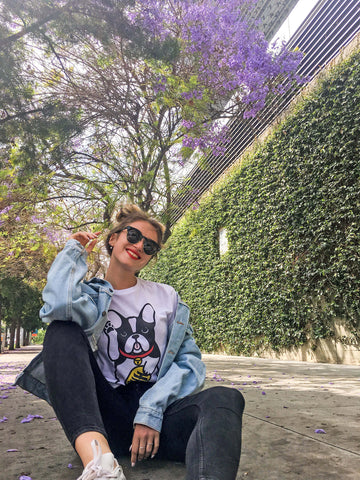 A model wearing a lucky dog graphic t-shirt.