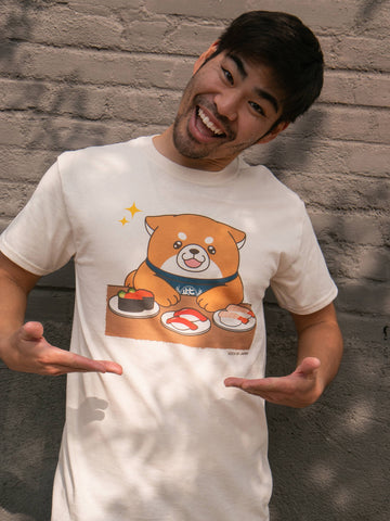 Model wearing a kawaii shiba dog at sushi bar T-shirt designed by artist Mochishiba.