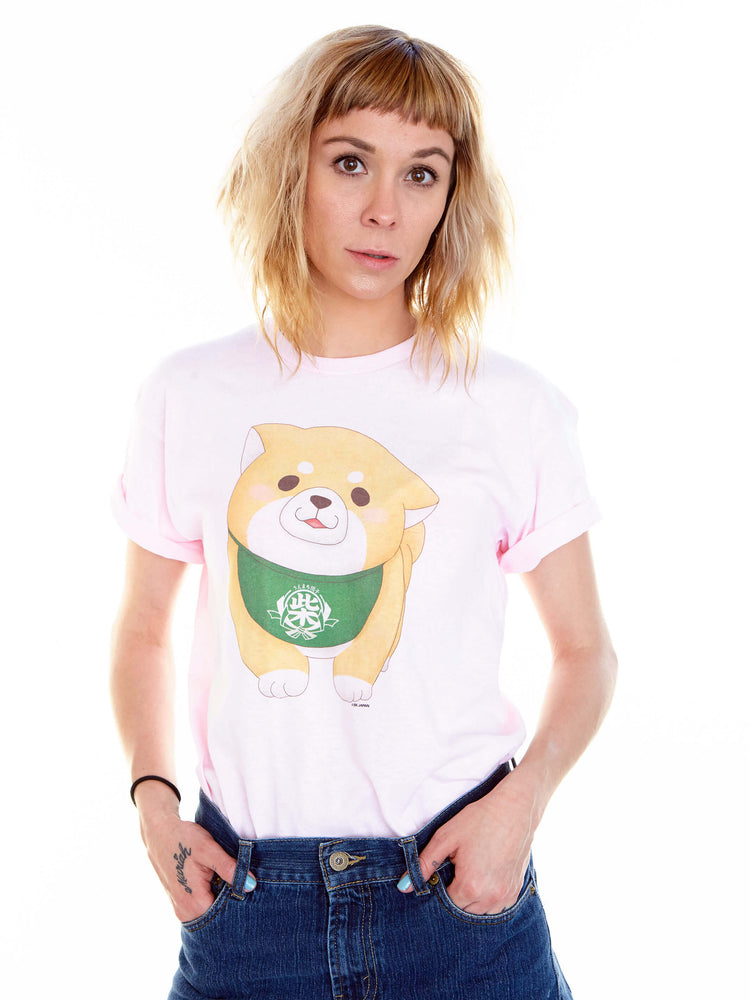 Model wearing a pink t-shirt with a cute shiba inu on it.