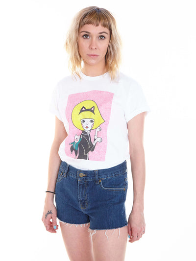 Model wearing a cartoon cat girl graphic tee.