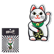 A white lucky cat patch.