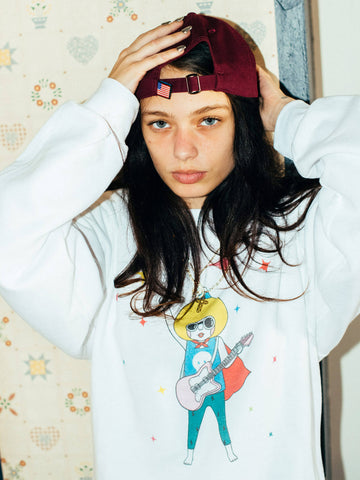Model wearing a kawaii rock n roll sweater.