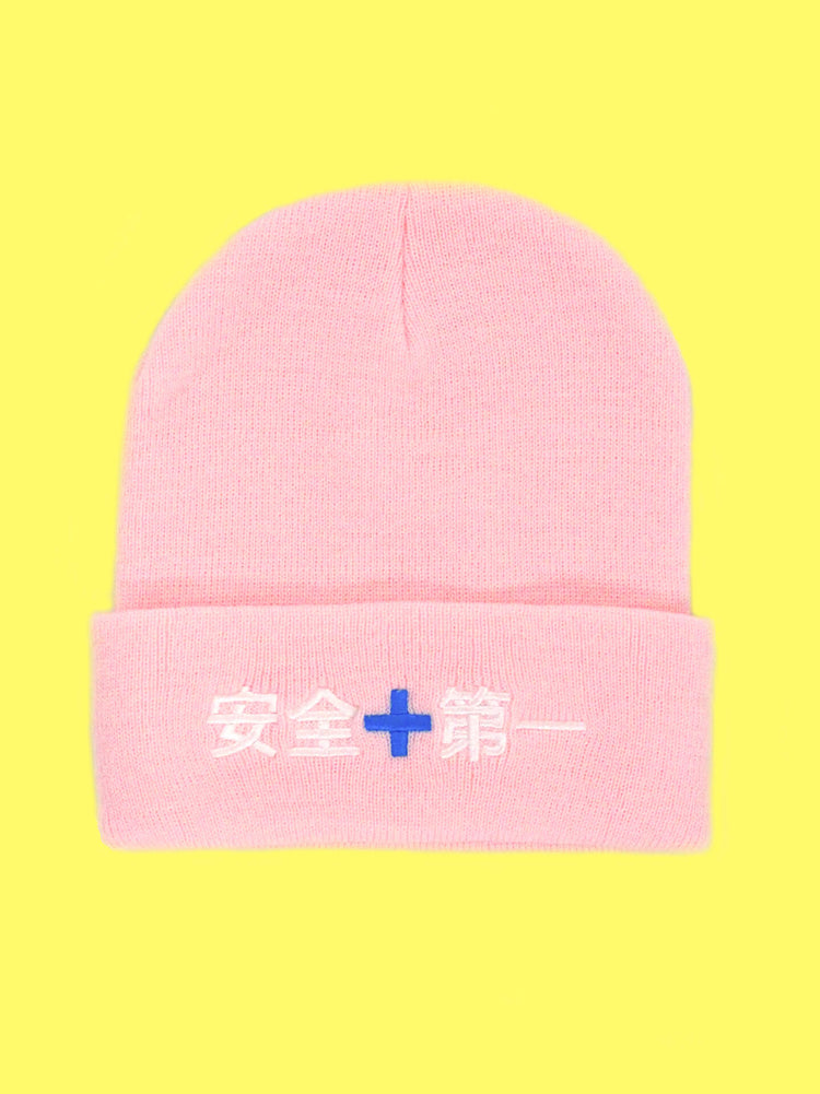 Pink Japanese construction worker beanie. Says 'safety first' in Japanese.