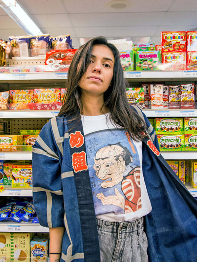 A model wearing a weird ukiyoe print t-shirt.