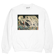 A white graphic sweater with a spooky Japanese skeleton on it.