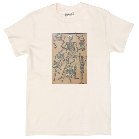 A beige t-shirt with ancient drawings of skeletons on it.