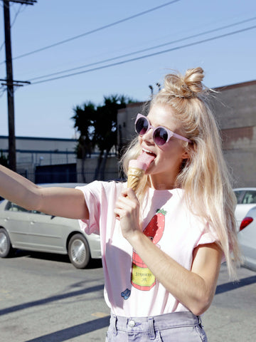 Kawaii model wearing a strawberry anime tee.