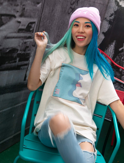 Model wearing 80s vaporwave city pop aesthetic woman's side profile design tee.