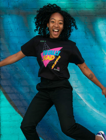 Model wearing 80s inspired t-shirt design by artist Warakami Vaporwave.