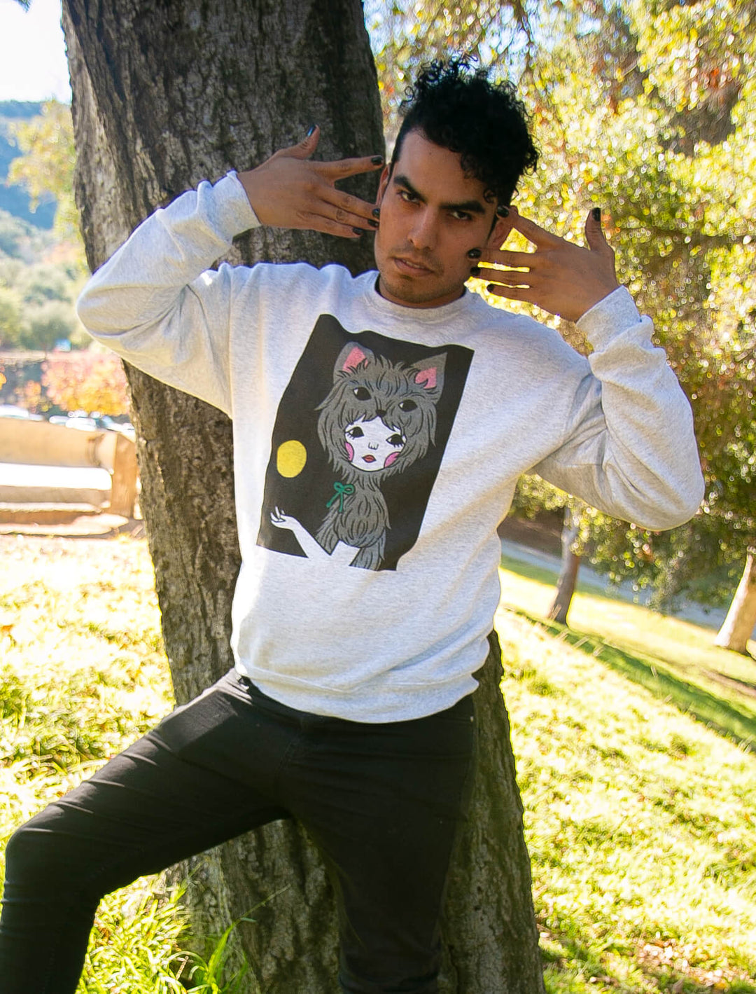 Model wearing a werewolf inspired graphic sweatshirt.